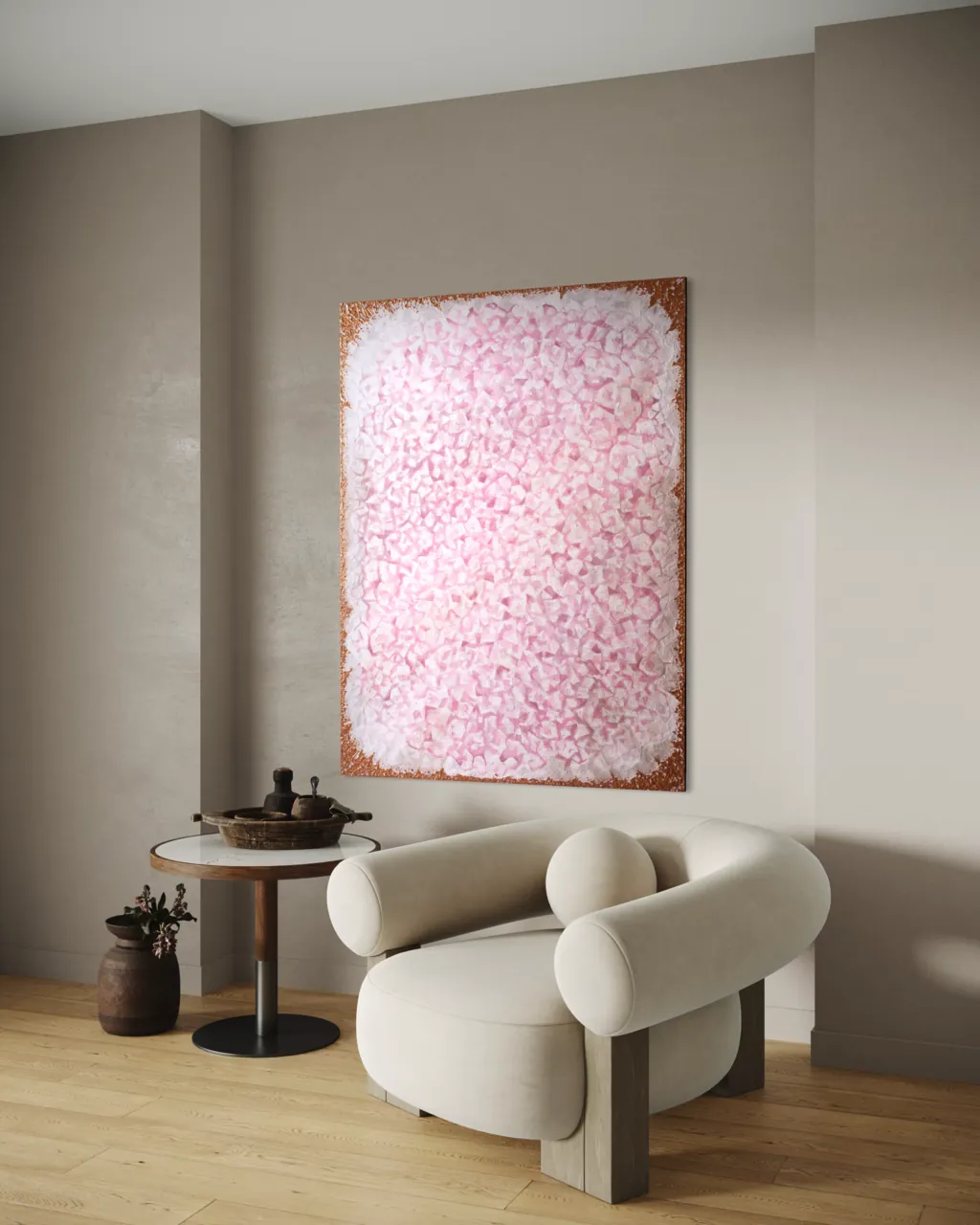 Rose Quartz painting above a round side table and a curved armchair in warm light