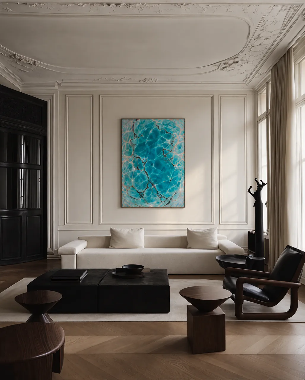 Turquoise painting in a Parisian salon with an ornate ceiling and a dark coffee table